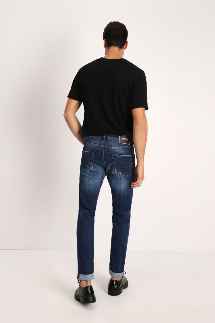 Jeans slim-fit effetto délavé con orli risvoltati